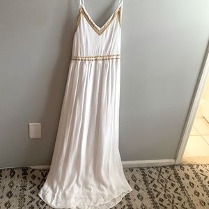 White maxi dress with gold trim details